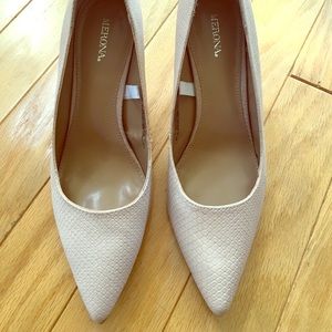 Pale pink snakeskin heels